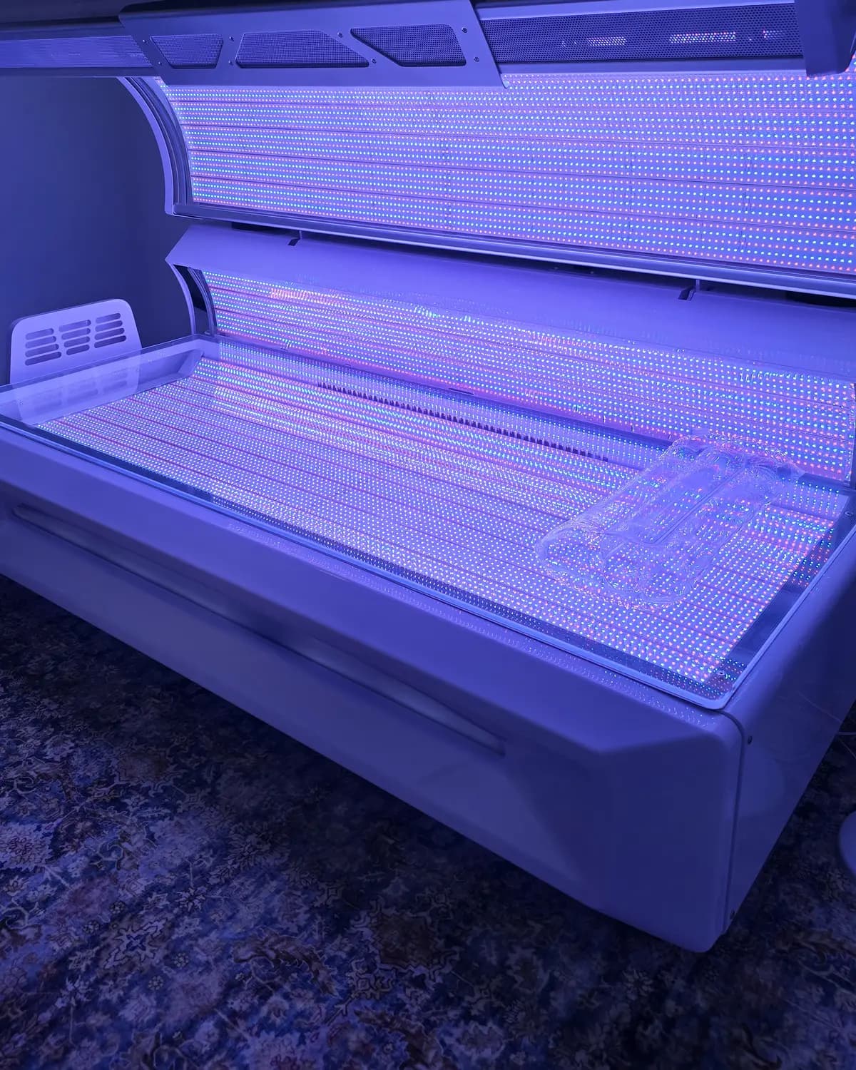 One of the two light beds at Starlight Haven, lid open, with all four colors on